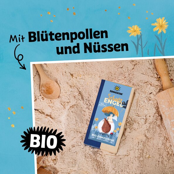 Sonnentor Schutzengel cookies on flour with wooden spoons, text "with flower pollen and nuts" and "organic"