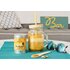 In the photo you can see an Iced Turmeric Latte in a glass. Next to it is the turmeric latte vanilla tin.