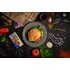 Burger with tomatoes, lettuce and cheese is next to the burger spice from SONNENTOR.