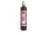 The syrup bottle features various fruits such as raspberries and grapefruits, as well as a person diving into a wine glass.