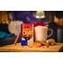 Cup of Christmas chai with milk foam, cinnamon and SONNENTOR "Christmas Chai" tea package